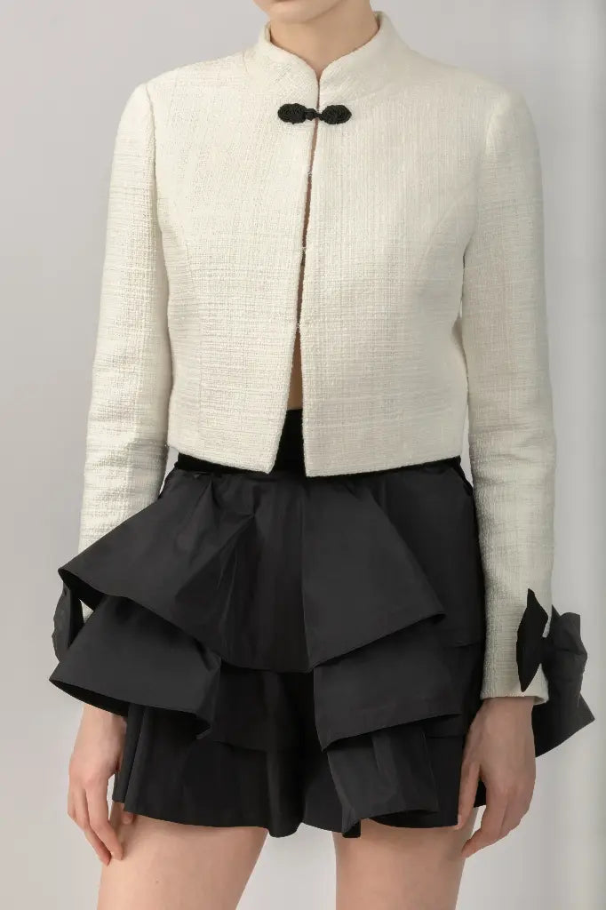 Kalmanovich tweed milk blazer with black bows